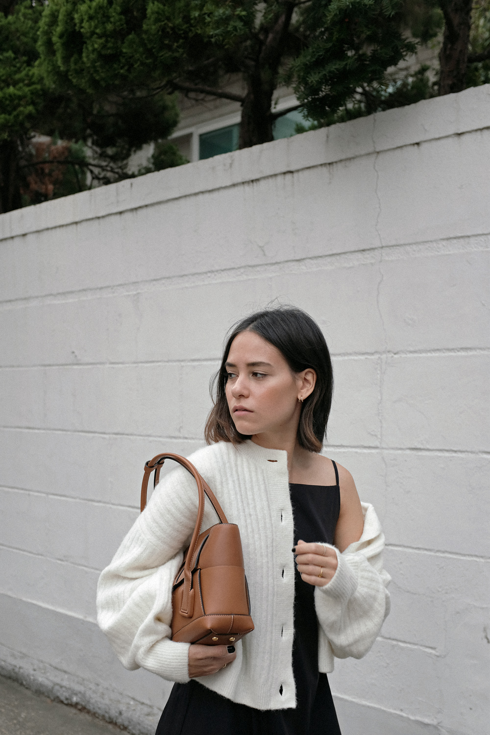 Bottega Veneta Arco 33 bag, Totême Flip-Flop heel, White oversized cardigan, A-line slip dress, Rainbow earrings
