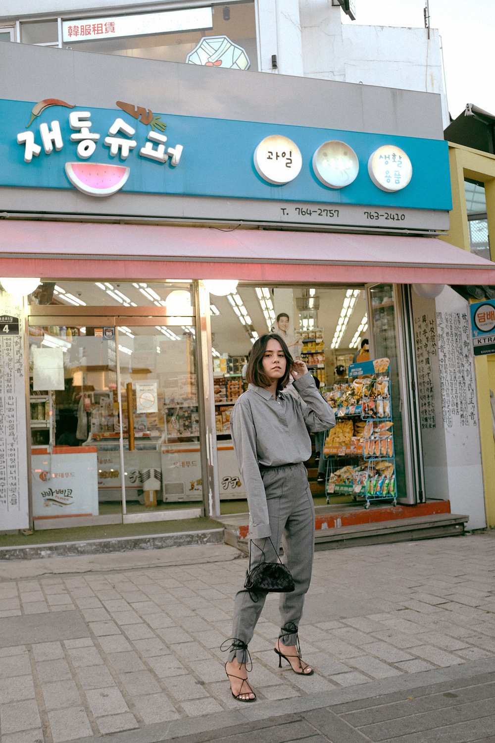 Double Grey in Seoul Outfit: Céline Naked Sandals, Bottega Veneta Pouch 20 in black, Arket Grey Suit Pants, Seidensticker Grey shirt