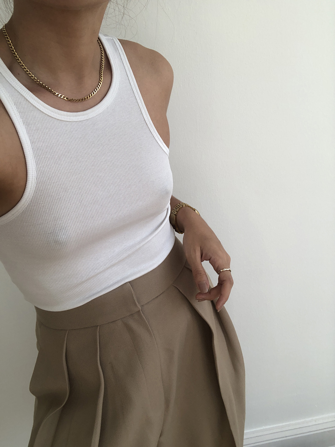 The Necklace Edit: Choker necklace. White racer back top, suit pants