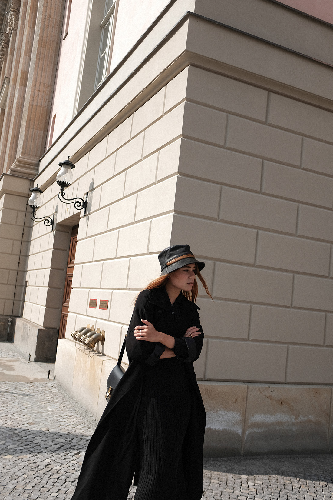 Desi is wearing a vintage Dior leather bucket hat, Edited the Label dress, Loewe loafers, Céline classic box bag, Tench coat from Seoul