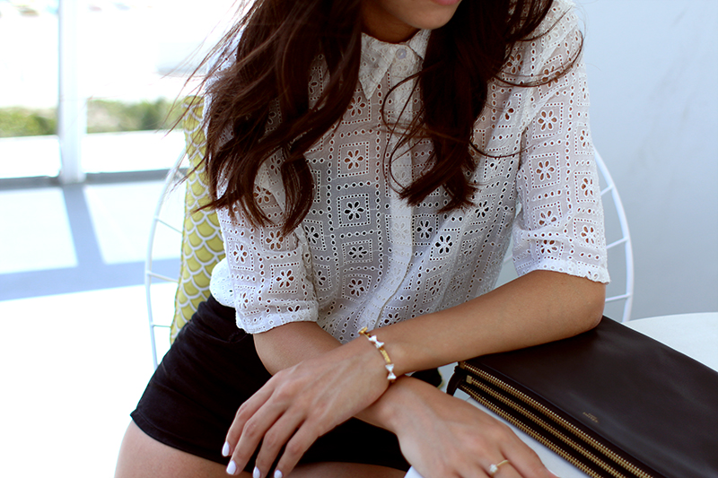 Nisi's Outfit: Buttoned-up lace shirt, high-waisted denim shorts from Zara, Céline Trio bag and studded espadrilles from Rebecca Minkoff