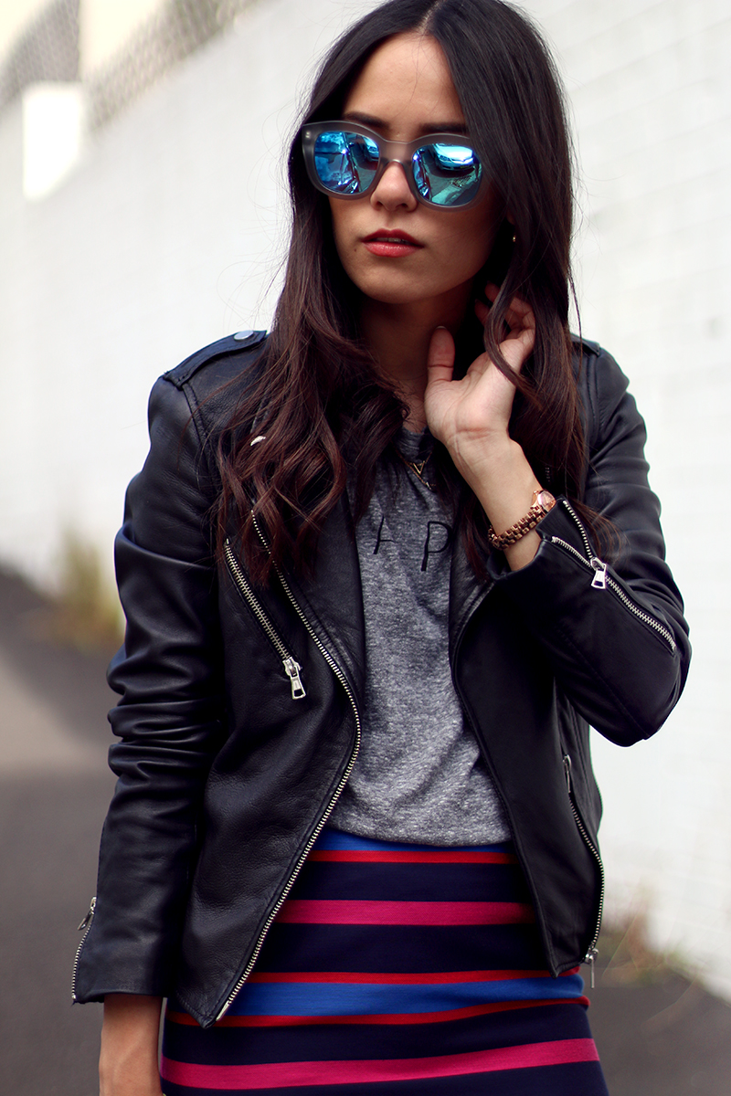 Nisi is wearing: Marc's Striped Skirt, Zara Leather Jacket, Le Specs Mirrored Sunglasses, Topshop Espadrilles and Céline Belt Bag Mini