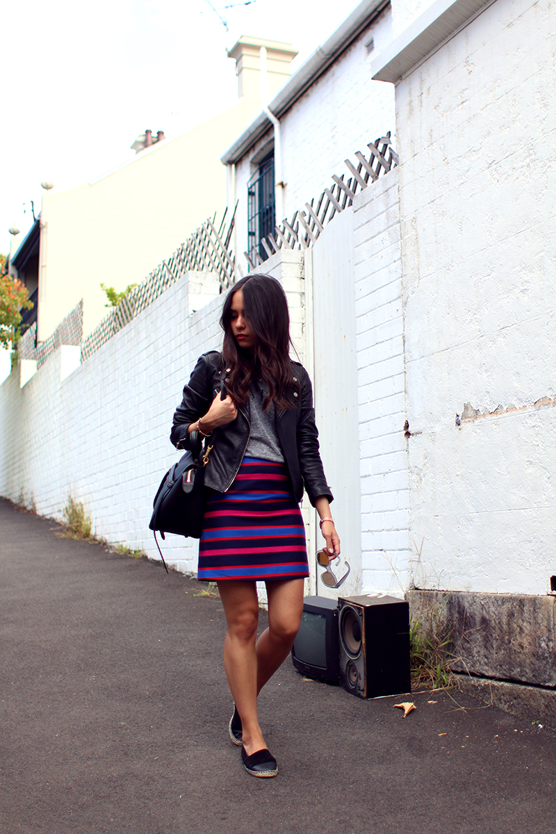 Nisi is wearing: Marc's Striped Skirt, Zara Leather Jacket, Le Specs Mirrored Sunglasses, Topshop Espadrilles and Céline Belt Bag Mini