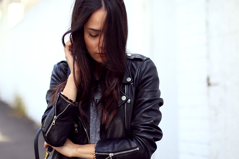 Nisi is wearing: Marc's Striped Skirt, Zara Leather Jacket, Le Specs Mirrored Sunglasses, Topshop Espadrilles and Céline Belt Bag Mini