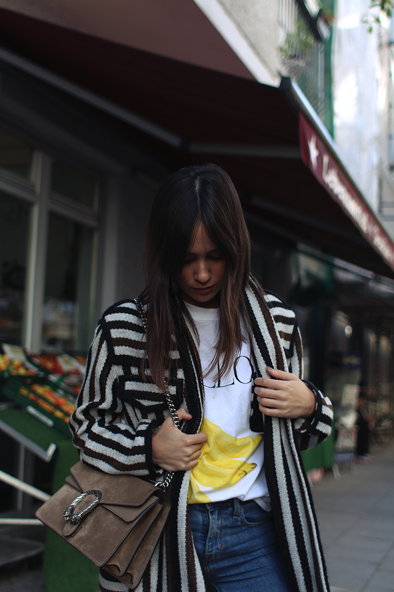 Nisi is wearing: Isabel Marant Étoile Breeda coat, Ganni murphy t-shirt, Levi's skinny jeans, Gucci Dionysus bag, Acne Studios jensen boots
