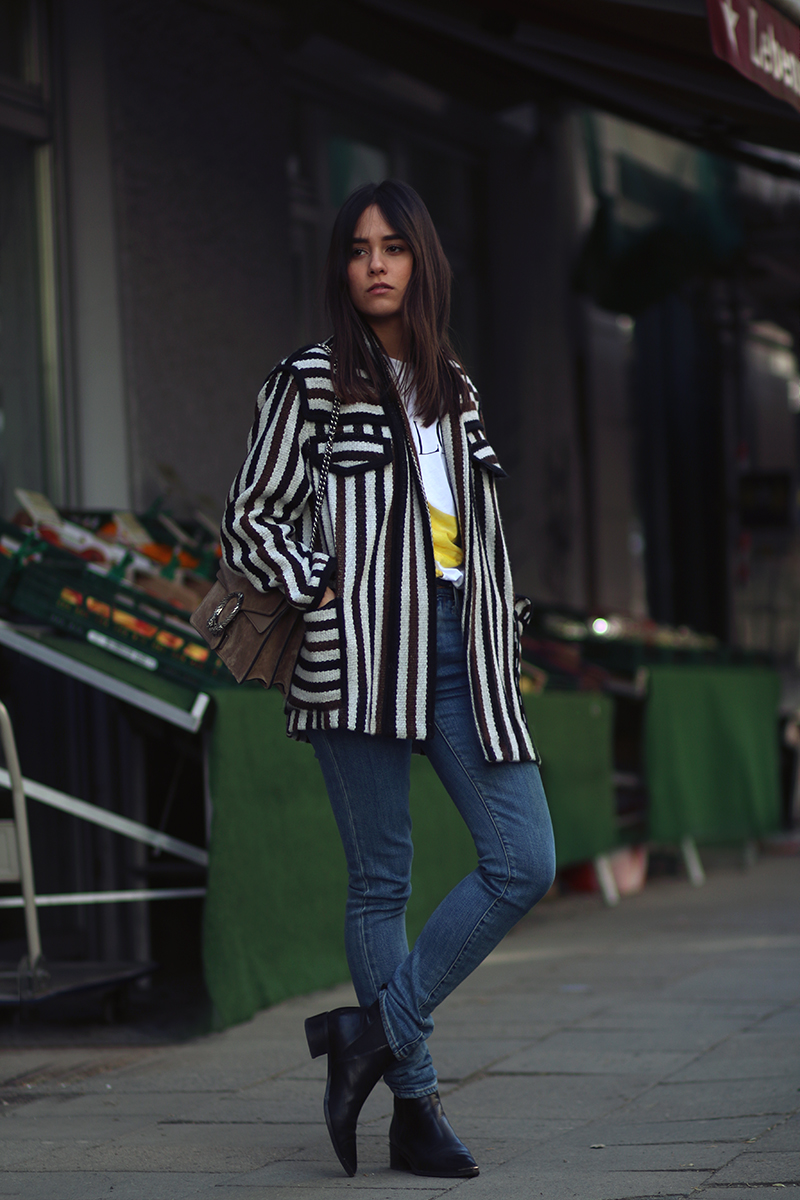 Nisi is wearing: Isabel Marant Étoile Breeda coat, Ganni murphy t-shirt, Levi's skinny jeans, Gucci Dionysus bag, Acne Studios jensen boots