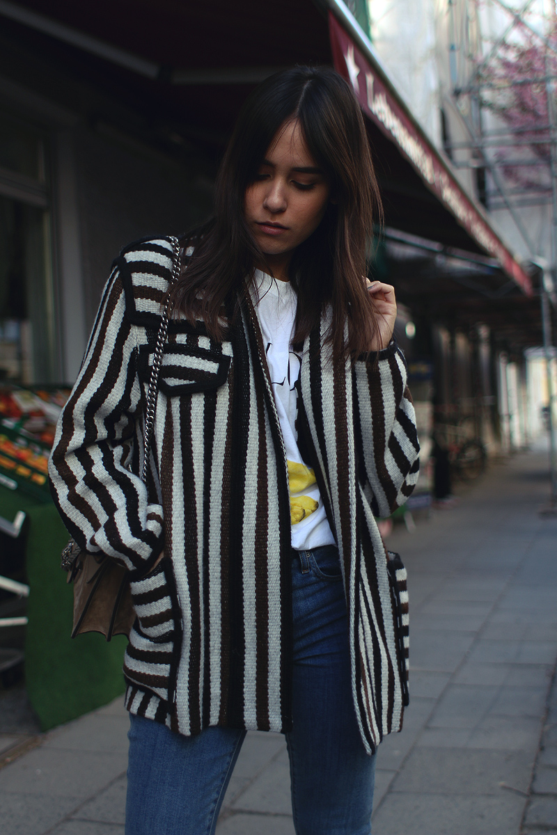Nisi is wearing: Isabel Marant Étoile Breeda coat, Ganni murphy t-shirt, Levi's skinny jeans, Gucci Dionysus bag, Acne Studios jensen boots