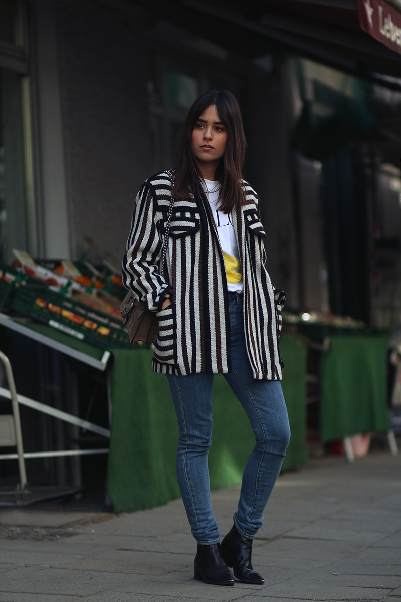 Nisi is wearing: Isabel Marant Étoile Breeda coat, Ganni murphy t-shirt, Levi's skinny jeans, Gucci Dionysus bag, Acne Studios jensen boots
