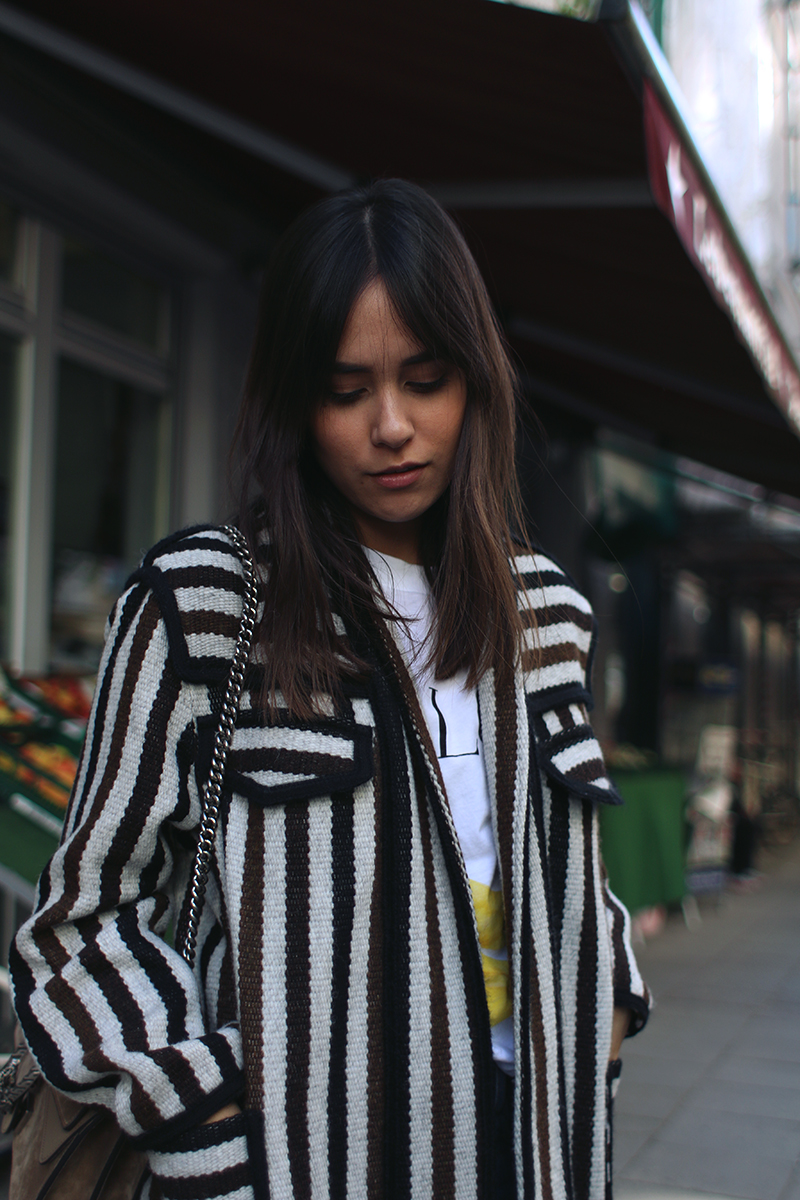 Nisi is wearing: Isabel Marant Étoile Breeda coat, Ganni murphy t-shirt, Levi's skinny jeans, Gucci Dionysus bag, Acne Studios jensen boots