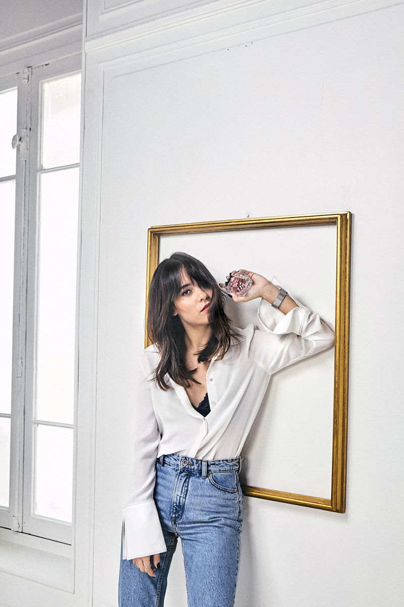 Nisi wearing: white blouse with big sleeves, mom jeans. Yves Saint Laurent Mon Paris shooting, shot by Max Montgomery