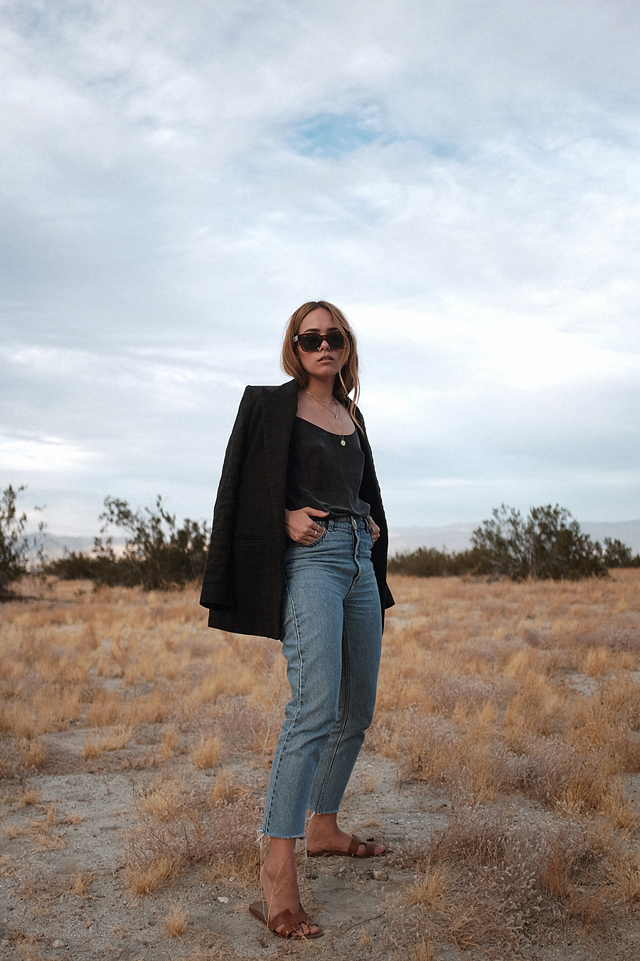 Outfit: Caping up that Blazer. Desi is wearing: Silk top, Blazer, Denim Mom jeans, Sandals, Céline Sunglasses, Brie Leon Earrings, Missoma Shark tooth necklace