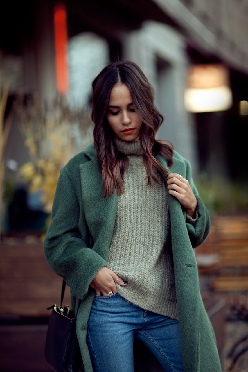 Nisi is wearing: Céline Trio Bag, Green Acne Studios Coat, Turtleneck Sweater, Topshop Girlfriend Jeans and Jimmy Choo Tide Sling-back Pumps