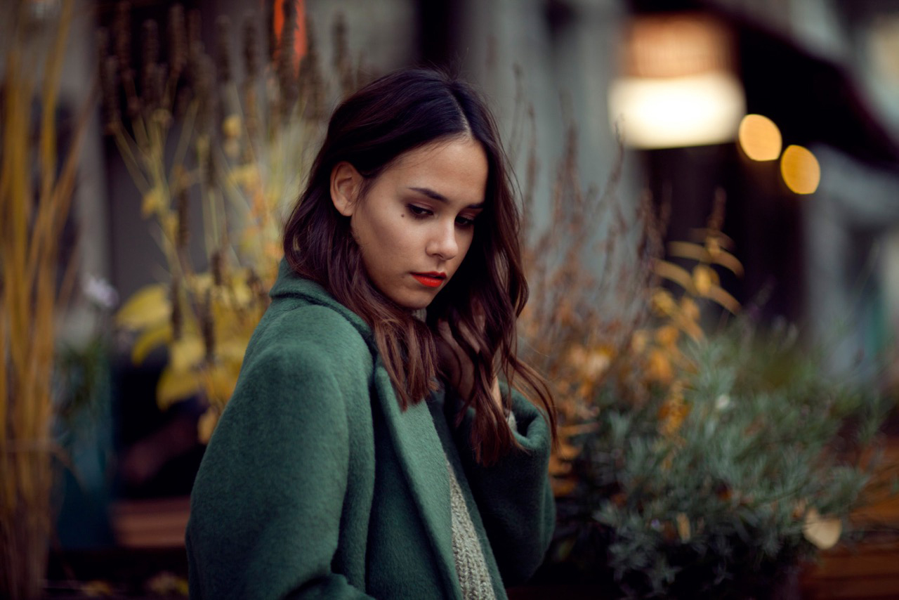 Nisi is wearing: Céline Trio Bag, Green Acne Studios Coat, Turtleneck Sweater, Topshop Girlfriend Jeans and Jimmy Choo Tide Sling-back Pumps