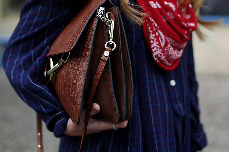 Desi is wearing: Isabel Marant Étoile Plaid Tunic, red bandana scarf, Adidas Stan Smith Sneaker, Chloé Faye Bag