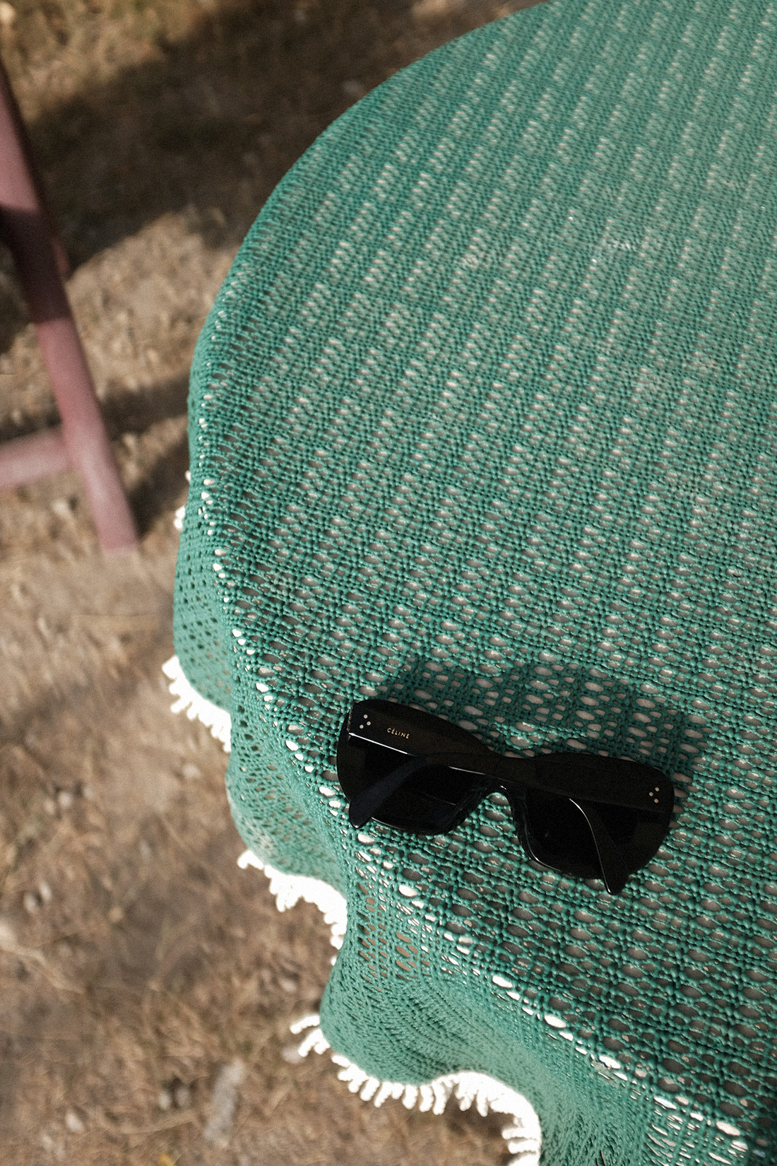 Desi is wearing: The Row Bow mules, Céline Sunglasses, Edited the Label Pinstripe blazer and pinstripe pencil skirt, Edited the Label silky white camisole