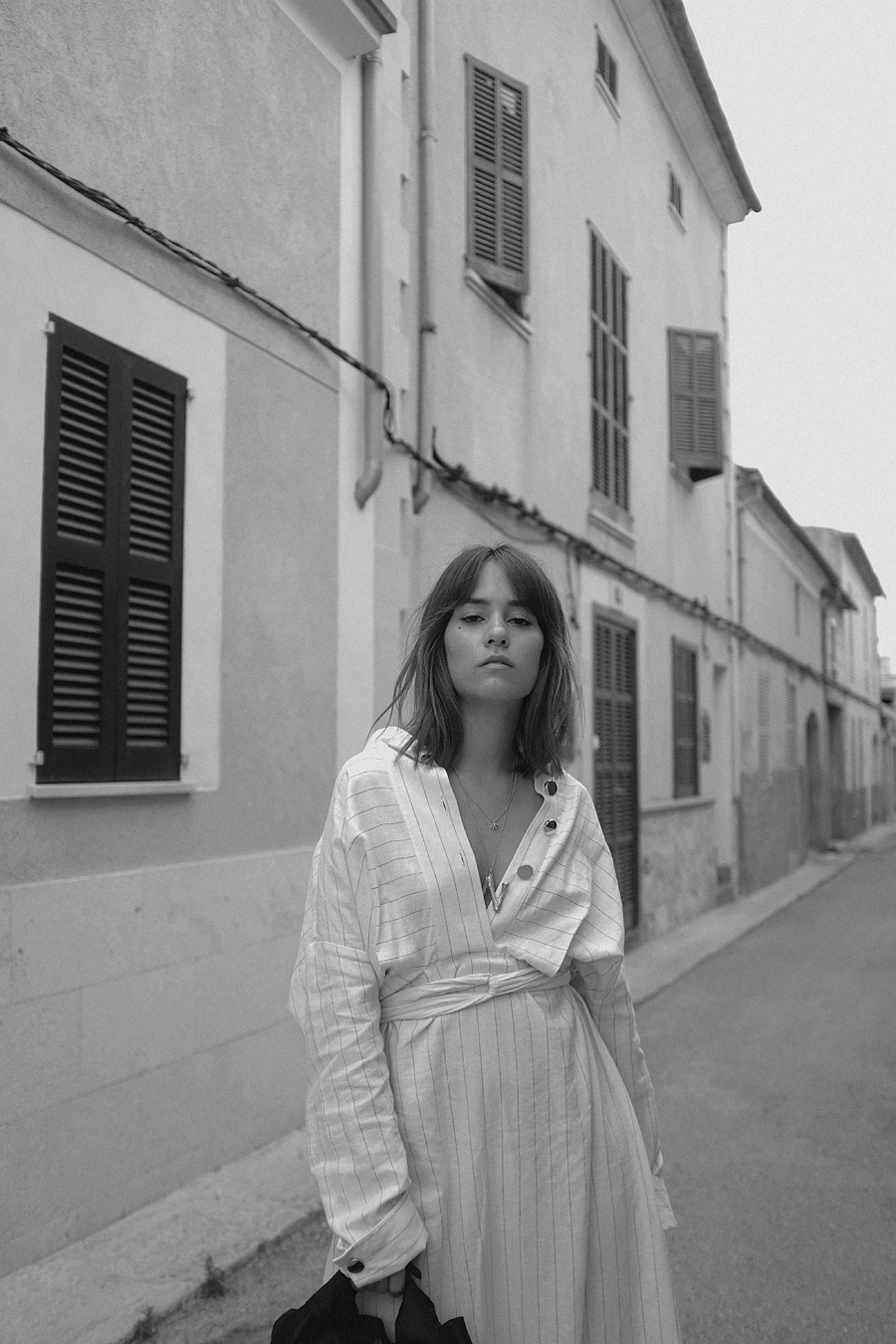 Video: The Row Ascot bag, Céline Alphabet necklace, Striped dress, Black strappy sandals, Coral necklace, Gold pearl earring